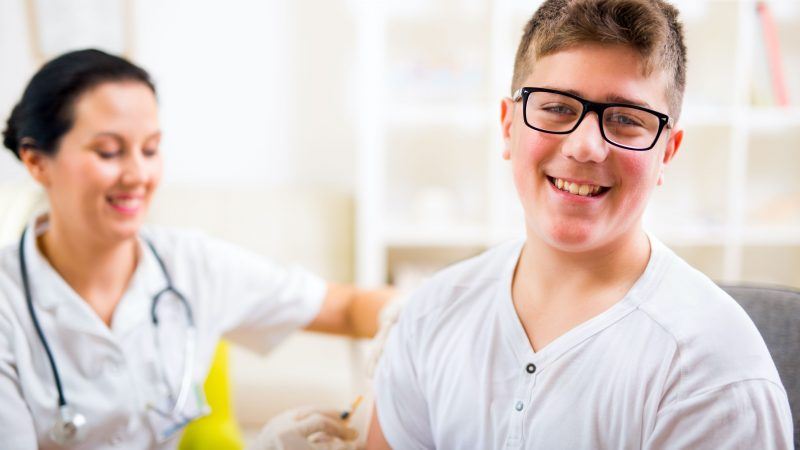 Young man receiving a vaccination